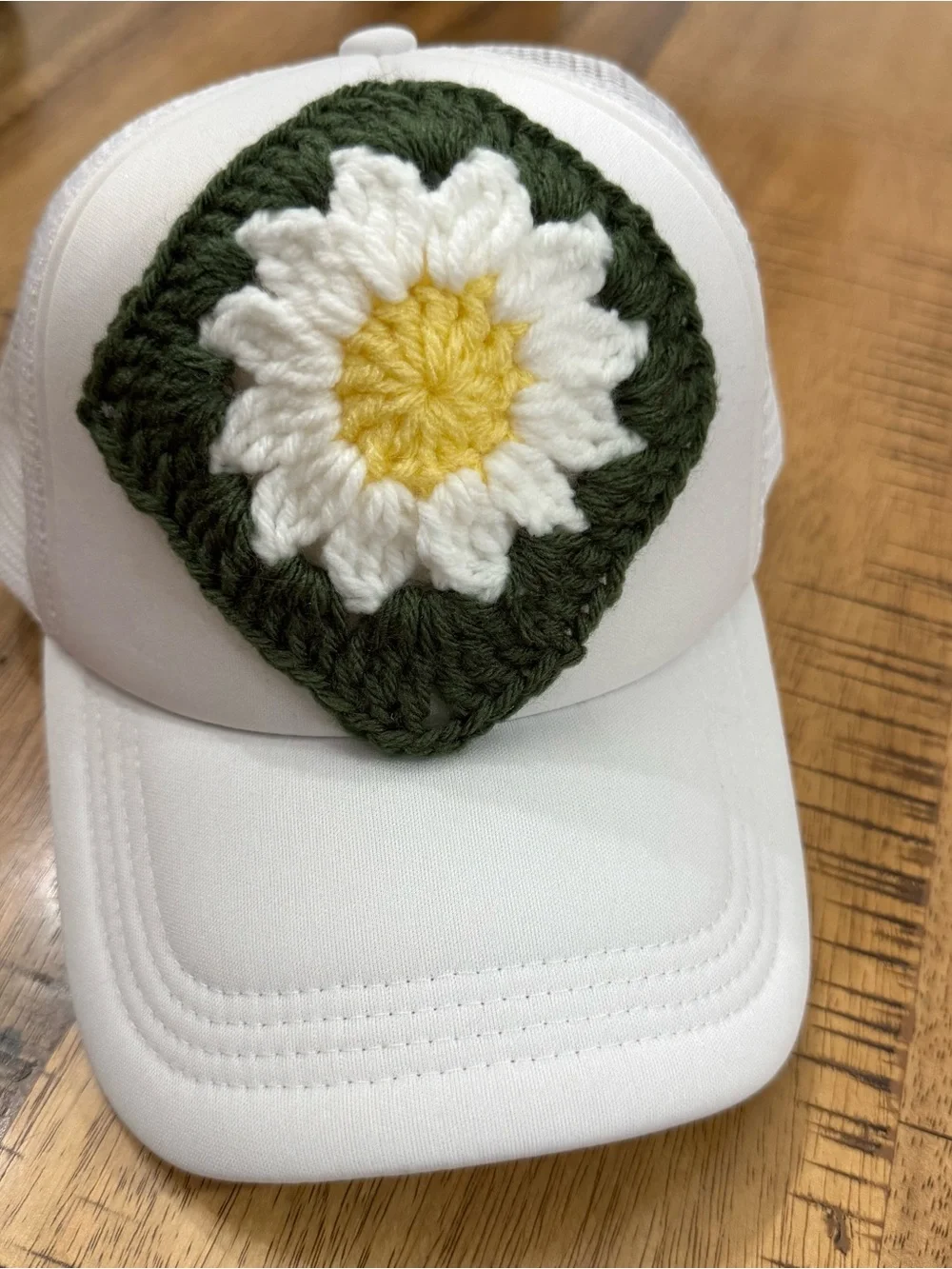 White Trucker Hat with Green Crochet Daisy Patch